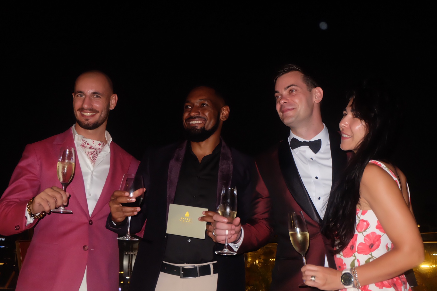 Guests with champagne at the Bassac rooftop evening