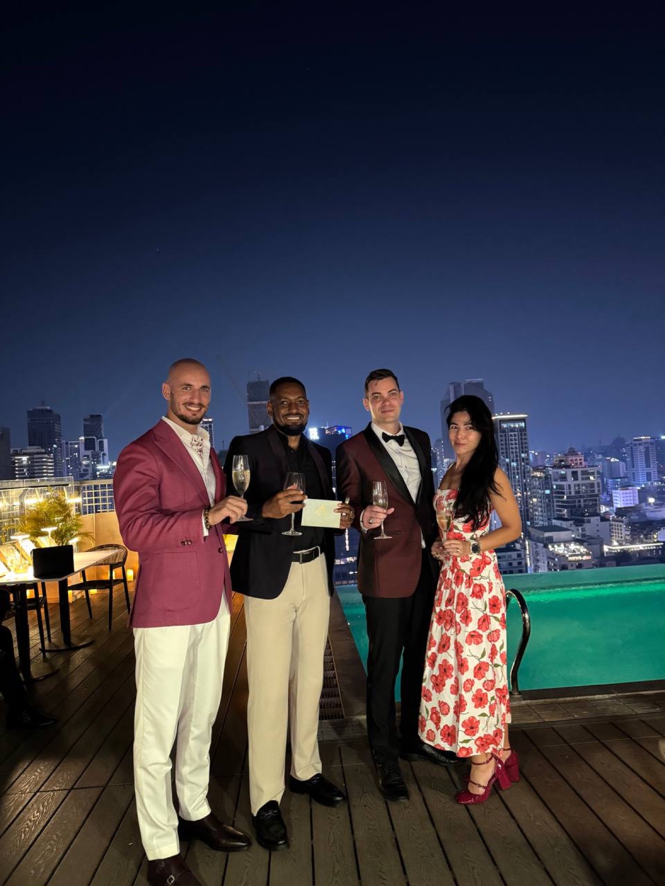 Guests in evening wear at a Phnom Penh rooftop event
